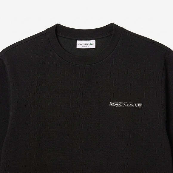 Black Lacoste sweatshirt close-up